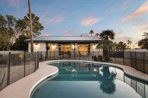Swim in the enclosed pool area.