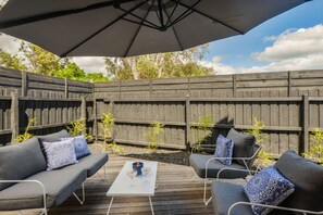 Outdoor area with large umbrella