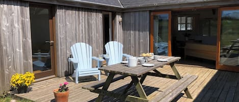 Spacious decking area, with spectacular views onto open farmland.