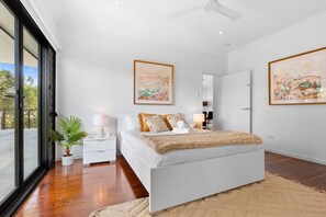 Master bedroom with direct access to the deck, built ins, ceiling fan and AC