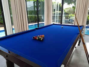 The third indoor living space with pool table