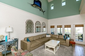 Large, open living area with amazing 30 ft vaulted ceiling.