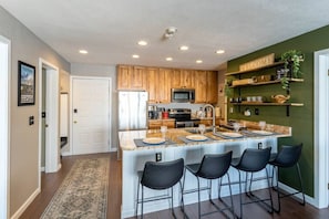 Four still bar seating at large kitchen island