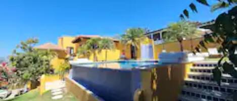The heated infinity pool in a backyard garden. A rare find.
