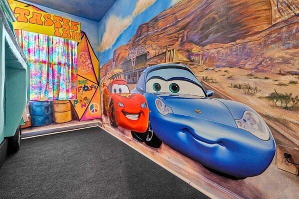 Rev up the fun in this vibrant car-themed room, perfect for young adventurers and fans of animated classics!