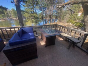 Lounging area with fire pit and amazing view of the lake