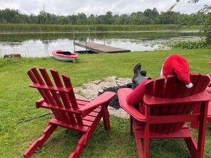 Santa enjoying a peaceful afternoon by the calm river.