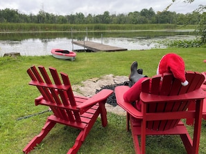 Santa enjoying a peaceful afternoon by the calm river.