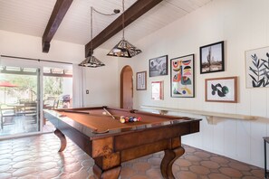 Plenty of ways to play and stay entertained, including a pool table inside and a ping pong table on the patio.