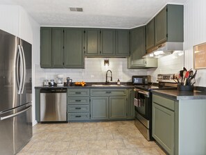 Feel at home in our cozy kitchen, it is fully equipped kitchen is ready for you to whip up delicious meals with ease.