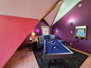 Game room w/ pool table, arcade games, board games, TV, and karaoke!