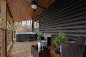 Relax in a large hot tub at Midnight Ridge Lodge.
