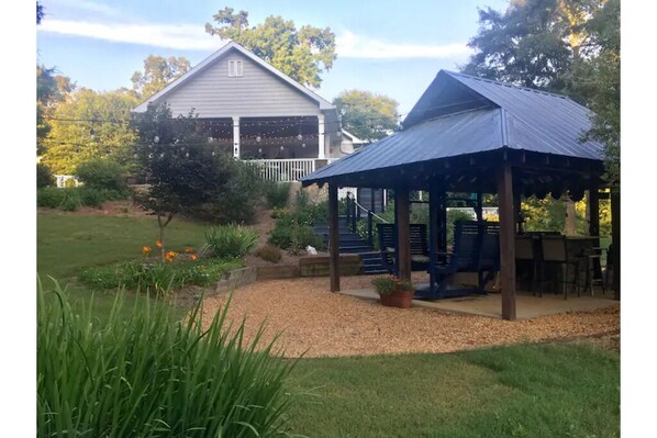 Grilling Hut with dining area and gliding swing.
