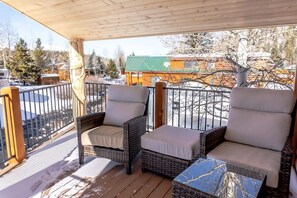 The private outdoor deck will become a favorite place to relax where you can enjoy the peaceful sounds of the running water from the two patio chairs.