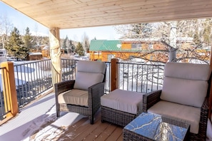 The private outdoor deck will become a favorite place to relax where you can enjoy the peaceful sounds of the running water from the two patio chairs.