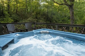 Private hot tub with forest views, creek sounds, and stargazing over 2 acres of rhododendrons.