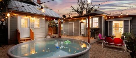 Enjoy the fiesta in a feature-filled backyard oasis! The 10ft heated cowboy pool, with a 125,000 BTU gas heater, is perfect for year-round fun.