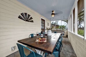 Savor a meal on the screened in porch, surrounded by nature