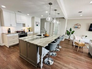 Brand new quartzite countertops in the spacious kitchen
