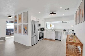 The kitchen overlooks the living room.  Very convenient layout for families and friends to spread out while still enjoying each other company and making lifelong memories.  