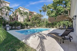 Brand new pool and hot tub with tropical landscaping and lots of seating!  