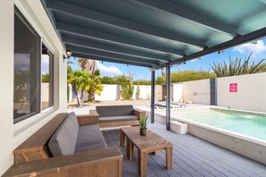 Outdoor lounge area by the pool