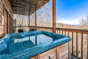 Soak away your stress in this large hot tub with gorgeous views.