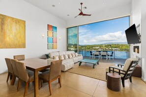 14' ft ceilings with 12' ft wall-to-wall slider that opens onto a large lanai.