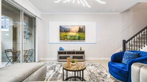Generous family reunion space, featuring a comfy sofa in a spacious living area for shared moments