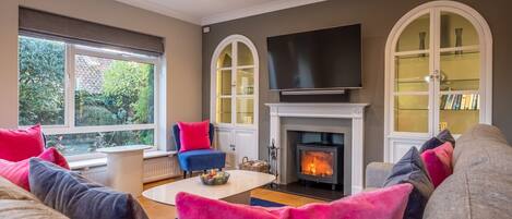 Over Norton: a stylish comfortable sitting room with wood burning stove