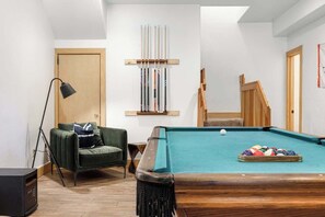Pool table and sitting area downstairs game room