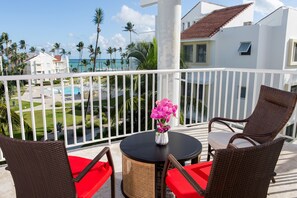 Large balcony with ocean view. Seating area. 