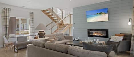 Living room offers plenty of seating around an electric fireplace and ROKU TV