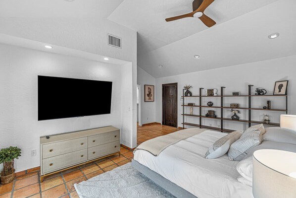 Relax in bed while enjoying access to your favorite streaming apps on the 65" smart TV