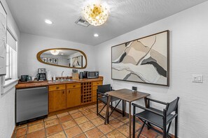 The spacious separate guest house with its own kitchenette and dining area