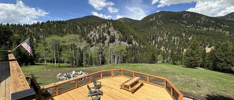 New large back deck recently added with view overlooking the Gallatin River