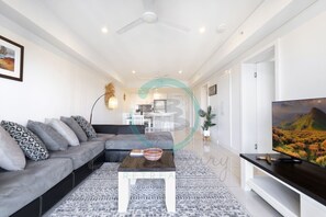 ZEN OCEAN BLISS - Cozy 2-BR/2-BA Sea View Retreat - Experience relaxation in our open-space living area, complete with a cozy sofa and entertainment hub, perfect for unwinding after a long day or enjoying a movie night in.