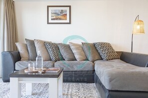 ZEN OCEAN BLISS - Cozy 2-BR/2-BA Sea View Retreat - Our spacious, large scale sectional sofa is perfect for snuggling in while enjoying a snack during movie nights