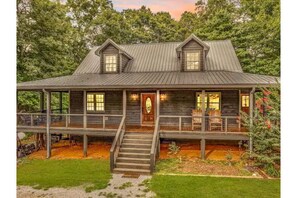 Wrap around porch with plenty of seating! Ideal spot to enjoy a cup of coffee. 