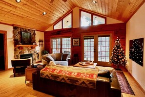 Great Room with propane fireplace, OLED TV, Sonos Arc and a 360° swivel couch. 