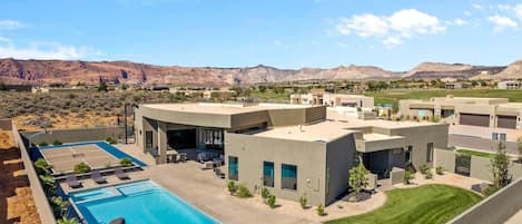 Back View - The Back View highlights the private pool, hot tub, basketball court, and grilling area, as well as the beautiful mountains surrounding our home.