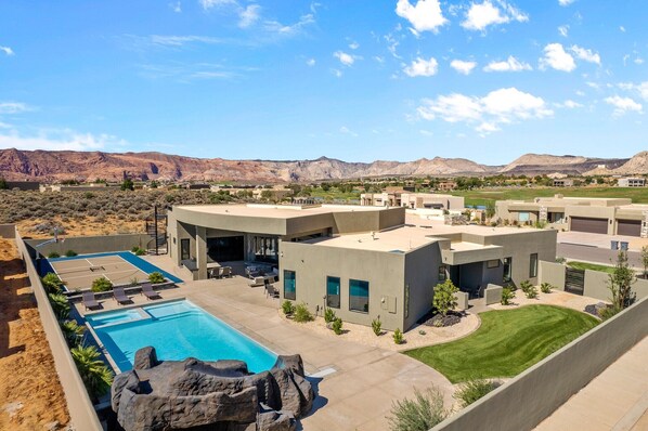 Back View - The Back View highlights the private pool, hot tub, basketball court, and grilling area, as well as the beautiful mountains surrounding our home.