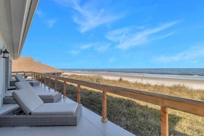 - Unwind on cushioned loungers just steps from the sand with panoramic oceanfront views
- Soak in salty breezes from your private balcony framed by wood and glass railing
- Ideal spot for sunrise coffee or sunset relaxation in comfort