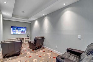 Theater Room - - Cozy up for movie night in this private theater room with plush leather recliners and flat screen TV
- Soft lighting, surround sound setup, and extra seating make it ideal for family film nights
- Your own cinematic experience just steps from the suite