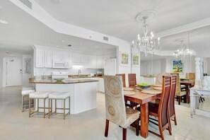 The integrated kitchen & dining area offer both functionality and style. With modern appliances and a sleek design, it's perfect for preparing delicious meals and enjoying them in the comfort of your home away from home.