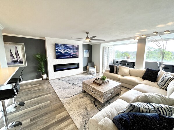 Large sofa sectional, smart TV, and fireplace await you!