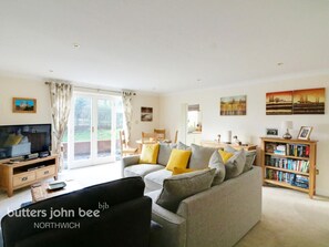 Lounge showing double doors out to Mill pond