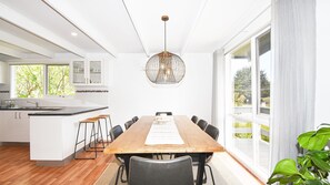 8 seat dining table beside the kitchen.