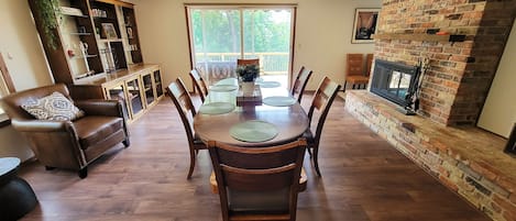 Great open area dining room and kitchen with mounted TV and Fireplace.