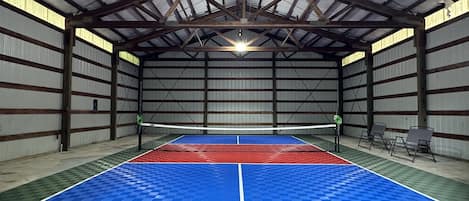 Bring everyone together in your private indoor Pickleball court! Complete with sports court, nets for volleyball or badminton, racquets and balls, and team benches!  